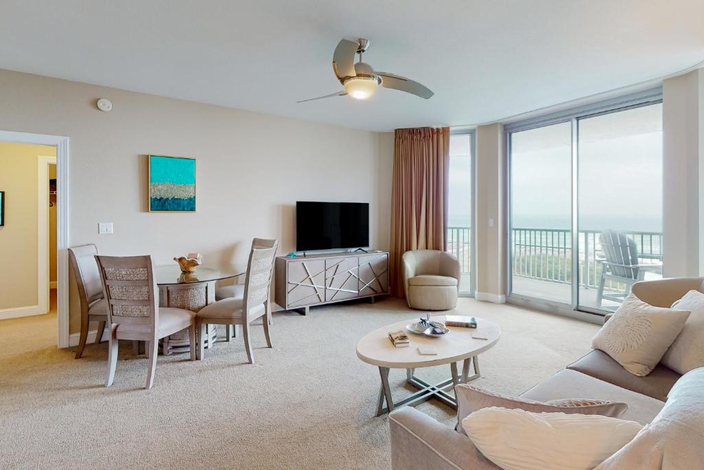 a living room with a couch and a table at Emerald Dolphin 0640 in Pensacola Beach