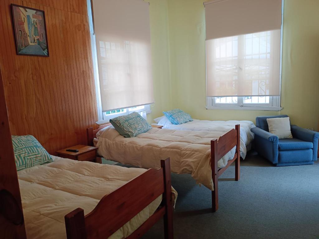 Postel nebo postele na pokoji v ubytování Hotel Paseo Valle