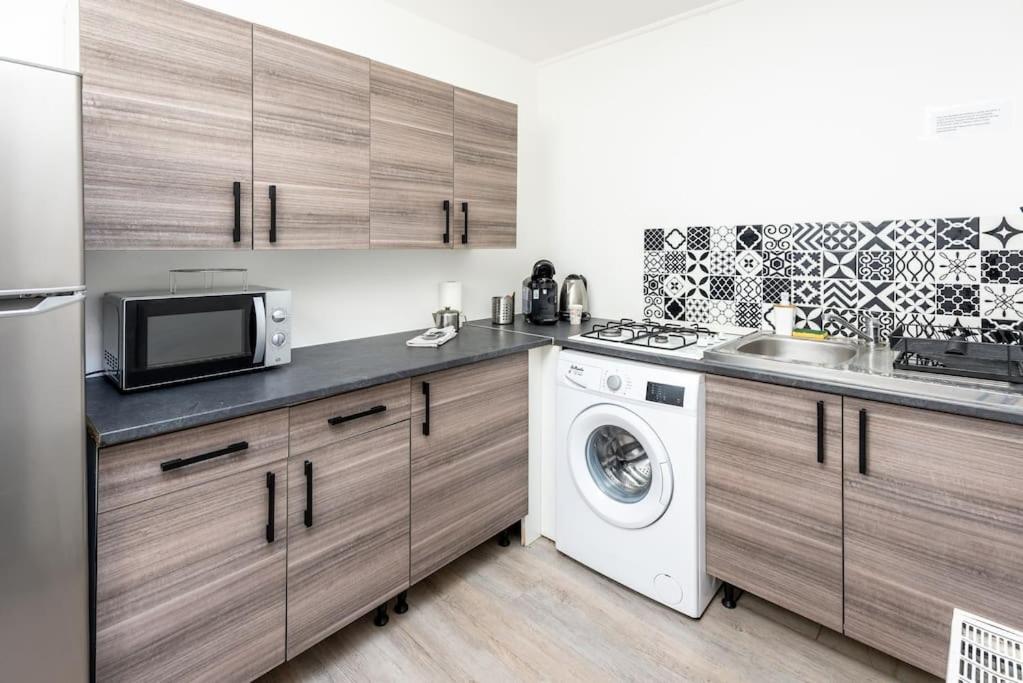 Kuchyň nebo kuchyňský kout v ubytování Uniq Home