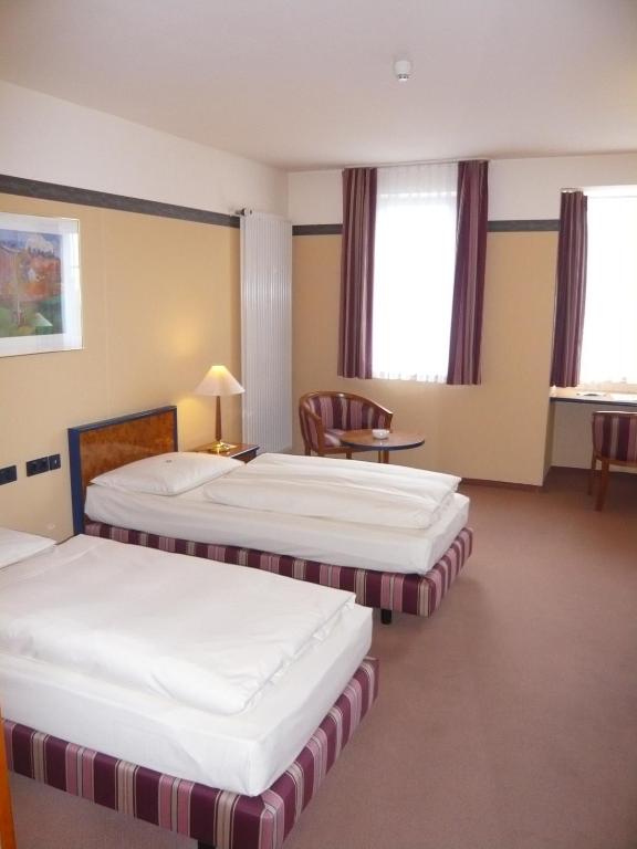 Postel nebo postele na pokoji v ubytování Hotel Falkenstein