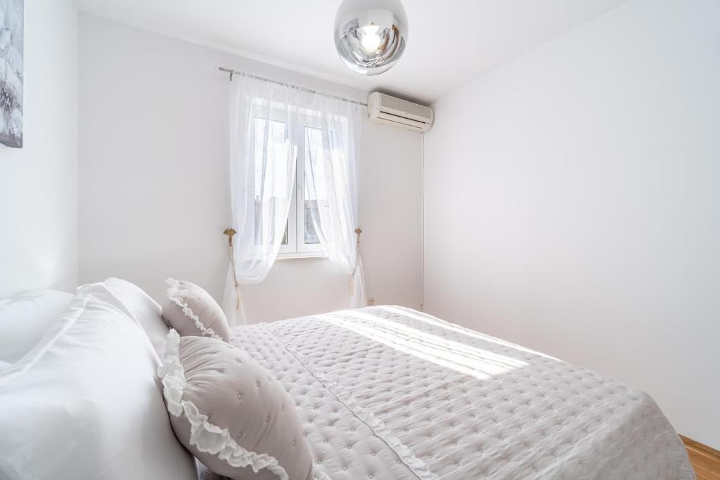 Postel nebo postele na pokoji v ubytování Apartment Mia