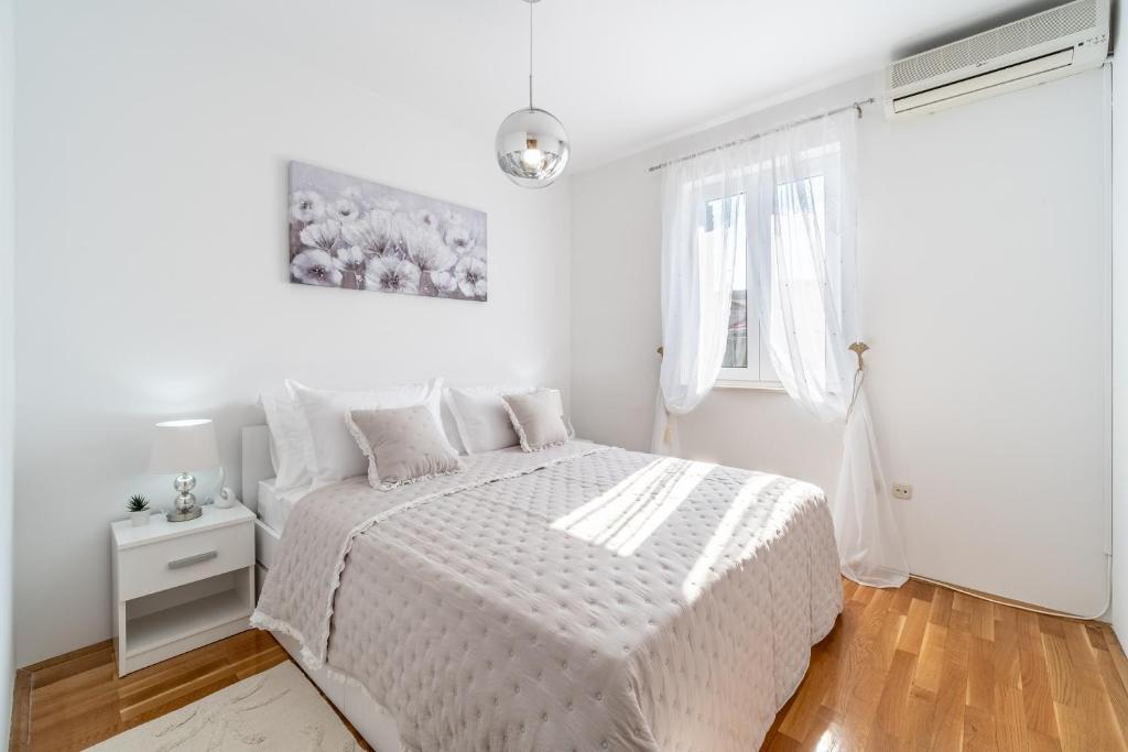 Postel nebo postele na pokoji v ubytování Apartment Mia
