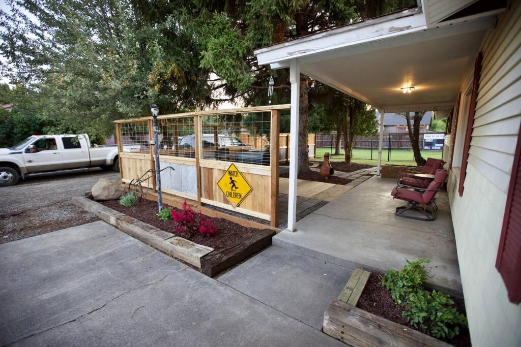 a porch of a house with a pedestrian crossing sign at Centrally Located Redmond Retreat with Pool Table in Redmond