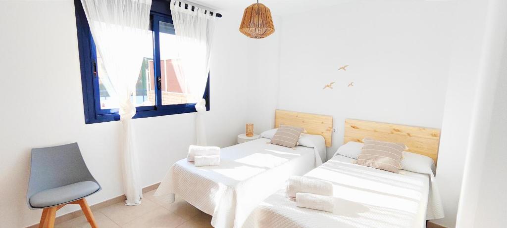 Posteľ alebo postele v izbe v ubytovaní Apartamento Sueños del Mar II by DENIA COSTA