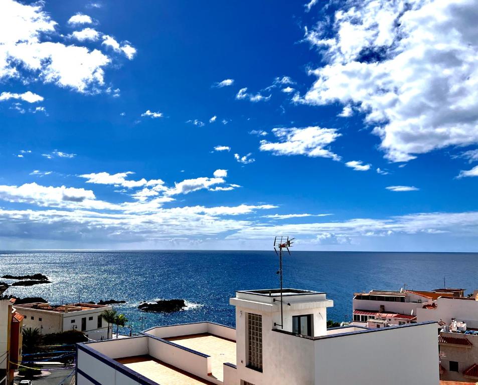 a view of the ocean from the top of a building at ALCAMAR APARTMENT! with beautiful views of the sea! in Alcalá