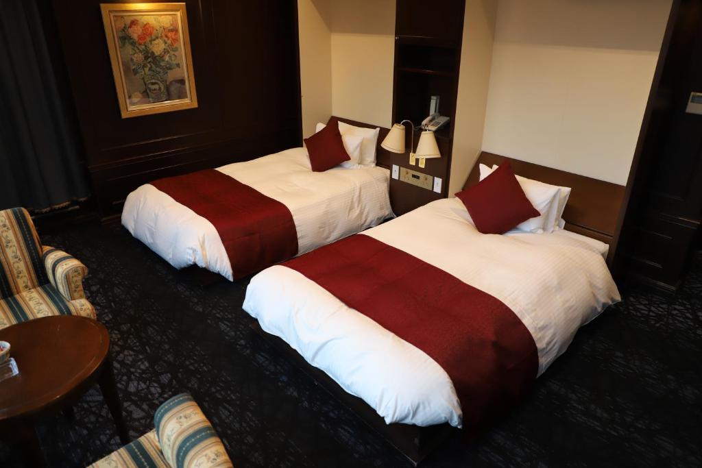 Postel nebo postele na pokoji v ubytování Hotel Sunlife Garden