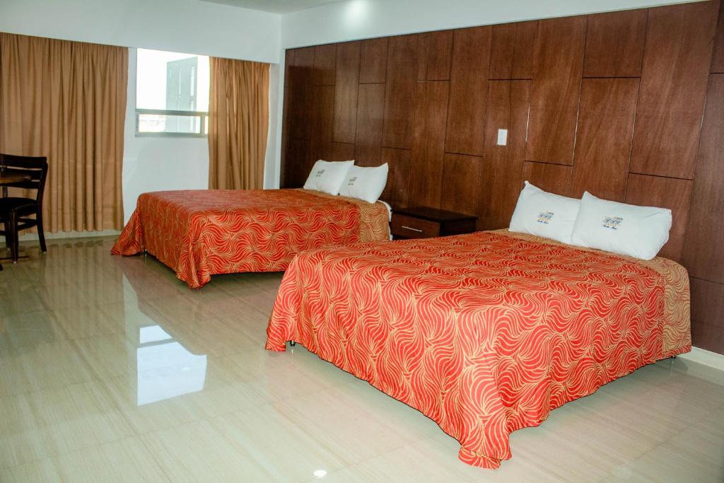 Postel nebo postele na pokoji v ubytování Hotel RRU Puebla