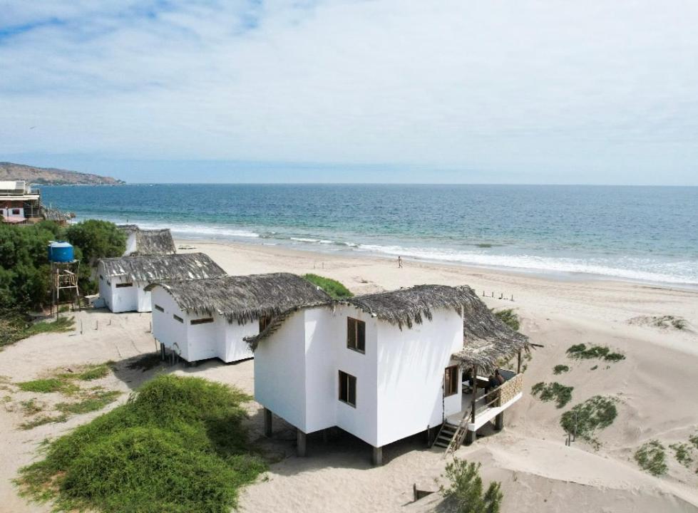a group of white houses on the beach at Mancora Soul in Máncora