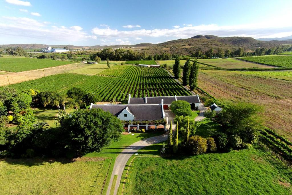 an aerial view of a house in the middle of a field at Beausoleil in Bonnievale