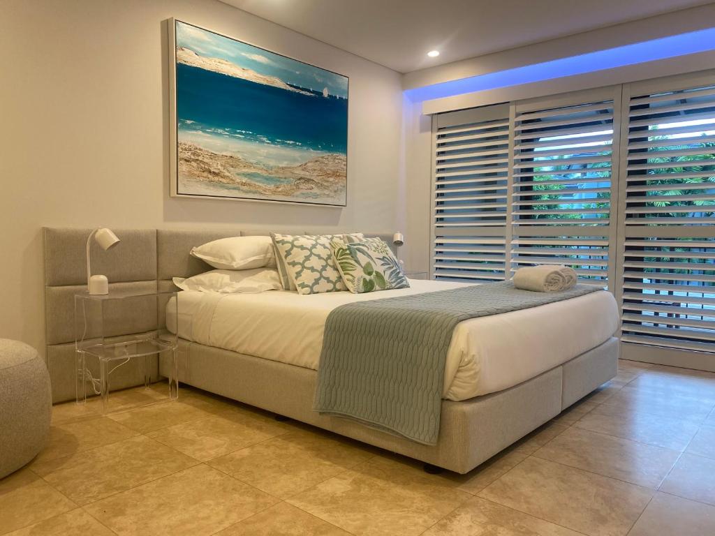 Posezení v ubytování AQUA Beachfront Villa Port Douglas
