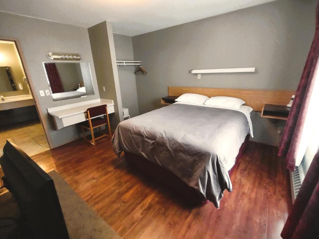 Postel nebo postele na pokoji v ubytování Stars Inn - Motel