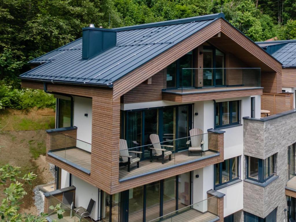 an aerial view of a house with a metal roof at Schmittenblick 3 in Viehhofen
