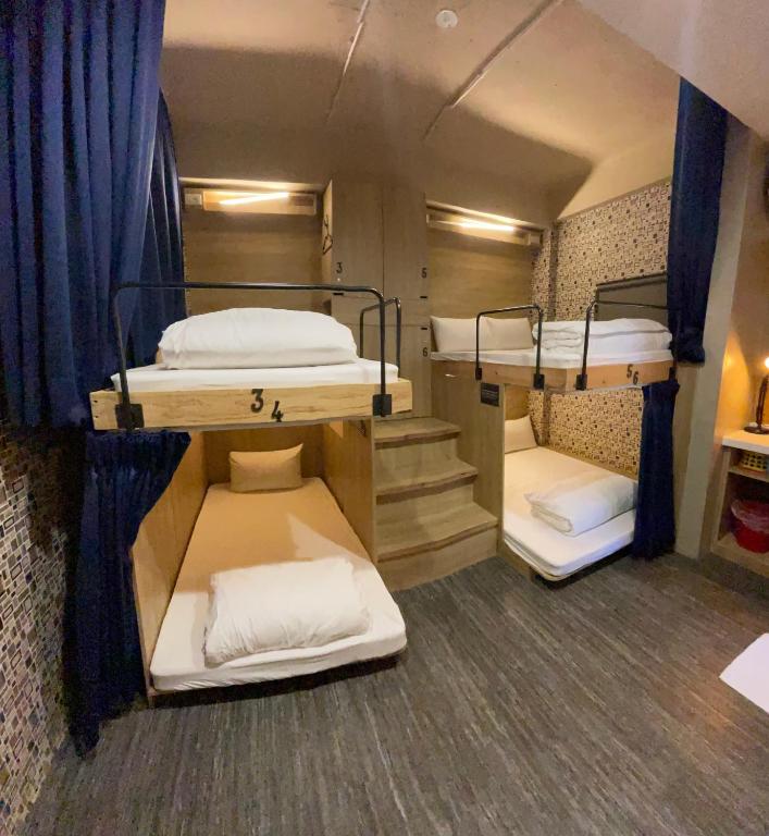 Postel nebo postele na pokoji v ubytování PH Hostel
