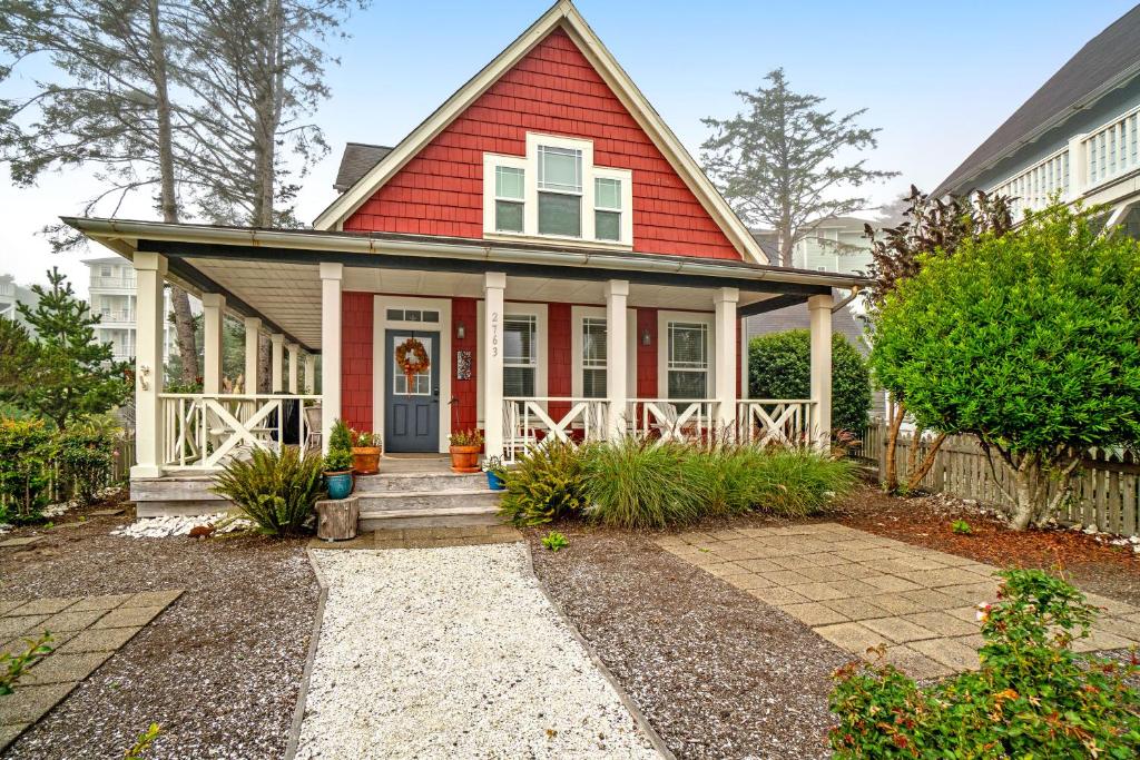 a home with a red house at Olivia's Rose in Lincoln City