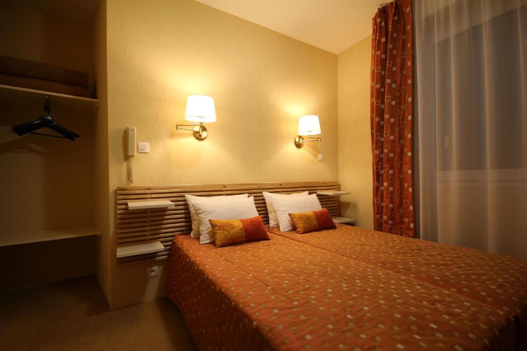 Cama o camas de una habitación en Hôtel Atlantic