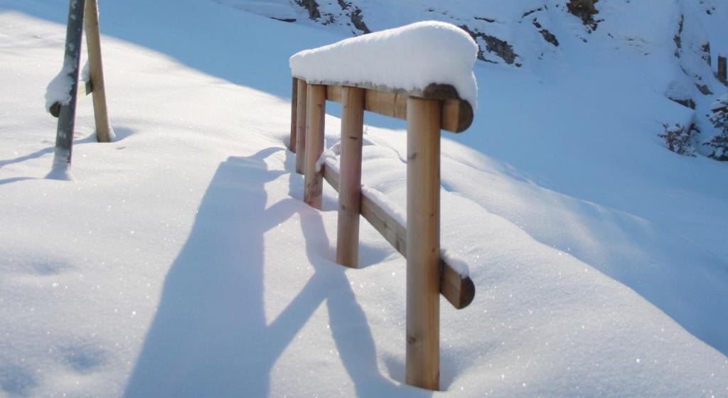 a snow covered object sitting in the snow at Apartments HAUS SCHÖN - Preise inclusive Pitztal Sommer Card in Jerzens