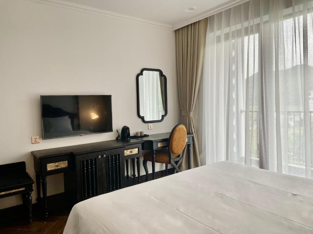 Ένα ή περισσότερα κρεβάτια σε δωμάτιο στο Eden Hotel Cát Bà