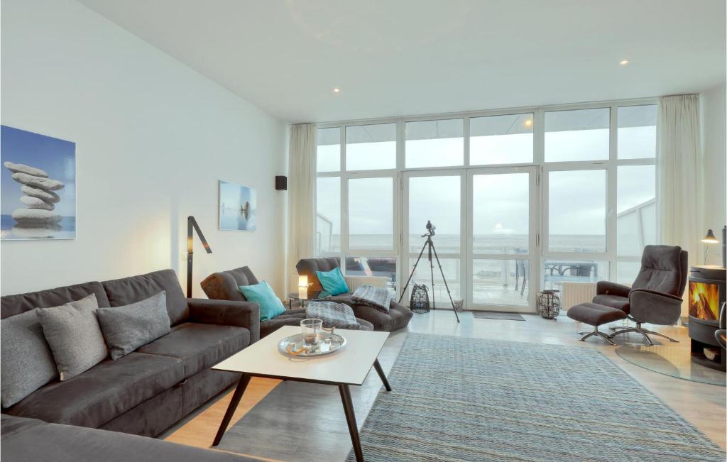 a living room with a couch and a table at Appartement Seestern D in Schönhagen