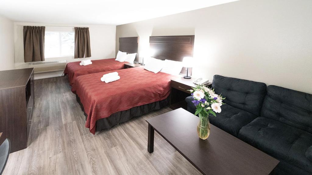 Postel nebo postele na pokoji v ubytování Ocean Star Inn