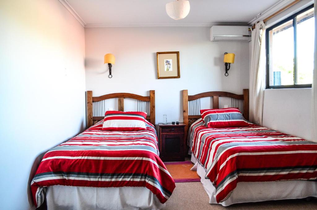 Uma cama ou camas num quarto em Hostal Cepa Noble