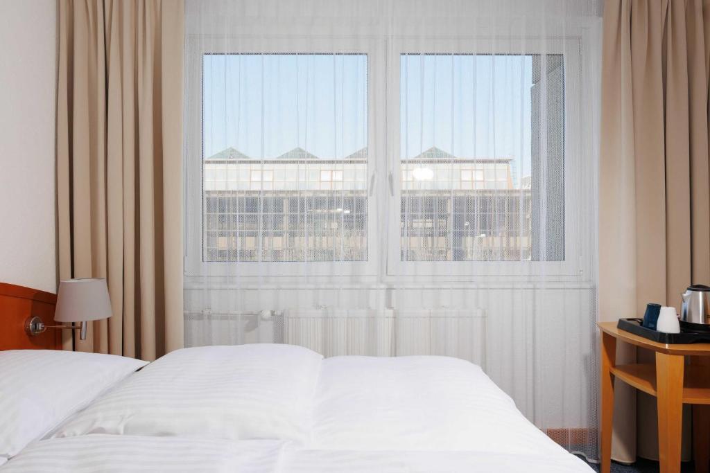 Postel nebo postele na pokoji v ubytování OREA Hotel Voro Brno