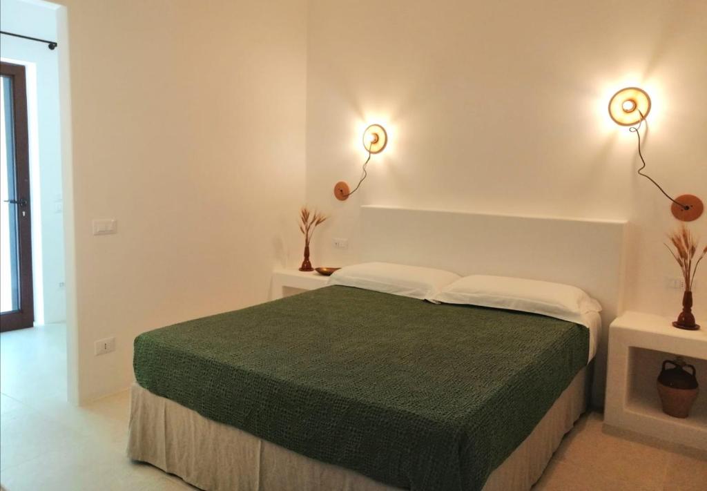 Postel nebo postele na pokoji v ubytování Intornoalnoce suites