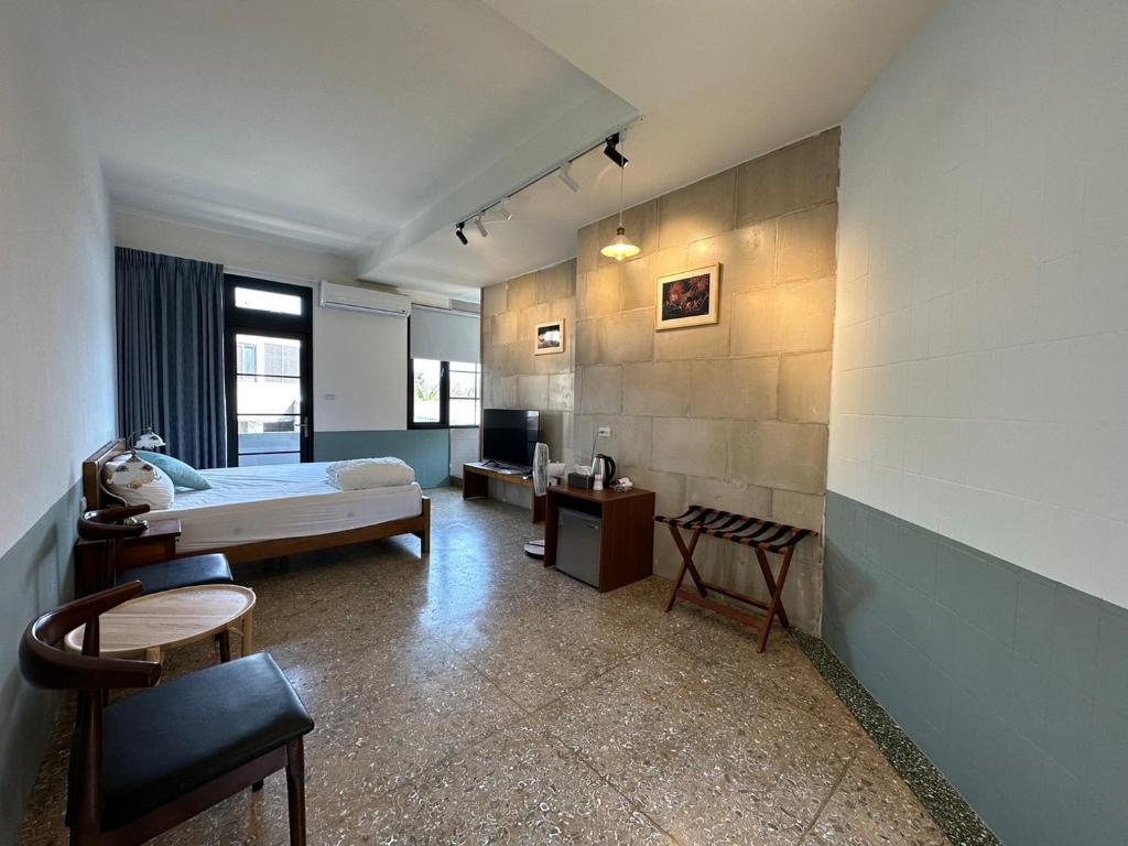 Postel nebo postele na pokoji v ubytování 九屏文旅 JP guesthouse
