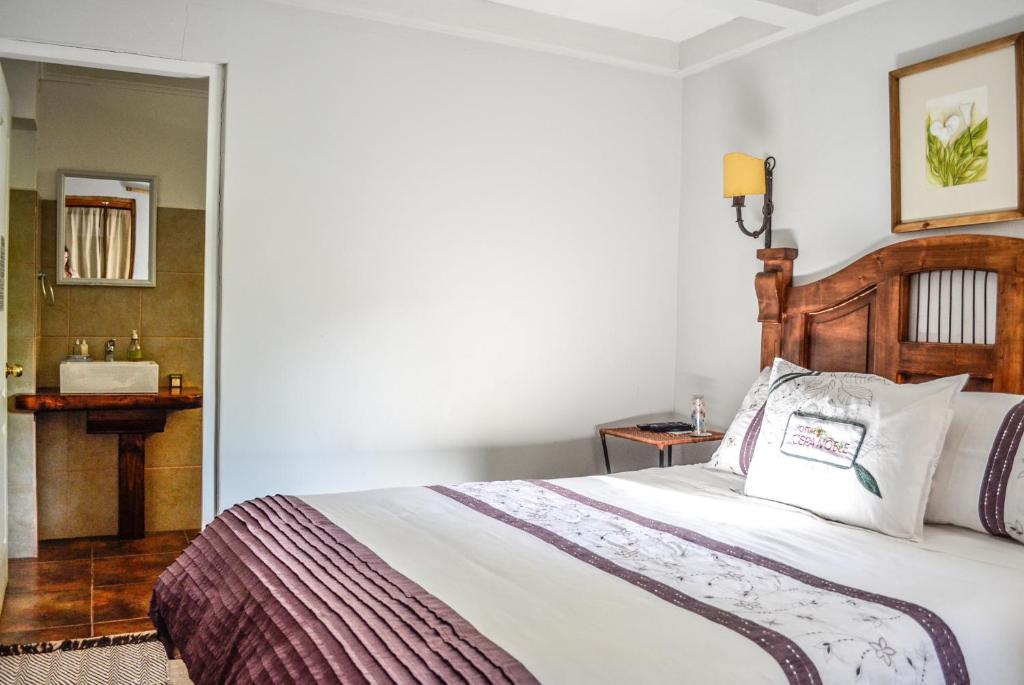 Uma cama ou camas num quarto em Hostal Cepa Noble