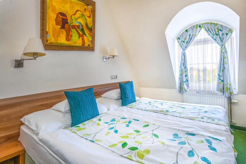 Postel nebo postele na pokoji v ubytování Hotel Kiss