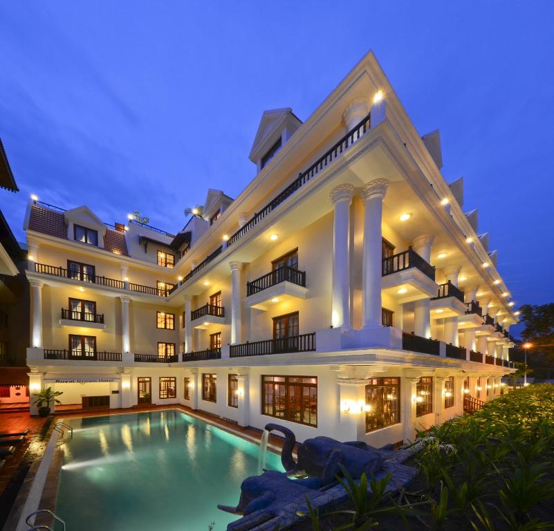 a large building with a swimming pool in front of it at Royal Crown Hotel & Spa in Siem Reap
