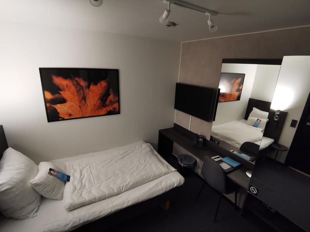 Letto o letti in una camera di Clarion Hotel Sense