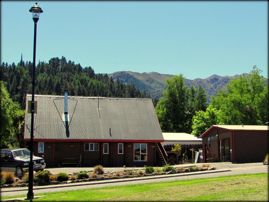 a large red building with a windmill on the roof at Hanmer Backpackers in Hanmer Springs