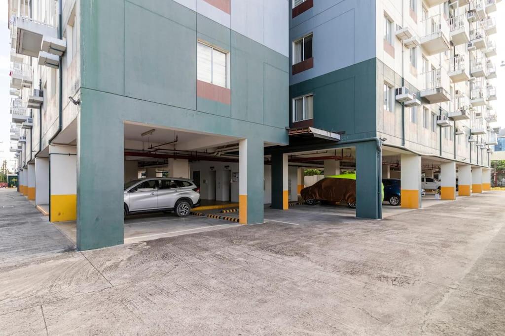 a parking garage with a car parked in it at Functional 1-br Space in Amaia with Fast Internet in Mandaue City