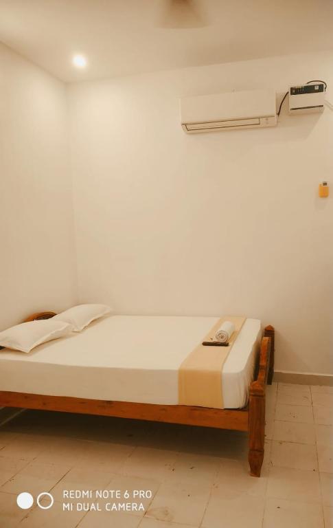 Postel nebo postele na pokoji v ubytování BlueMoon Homestay