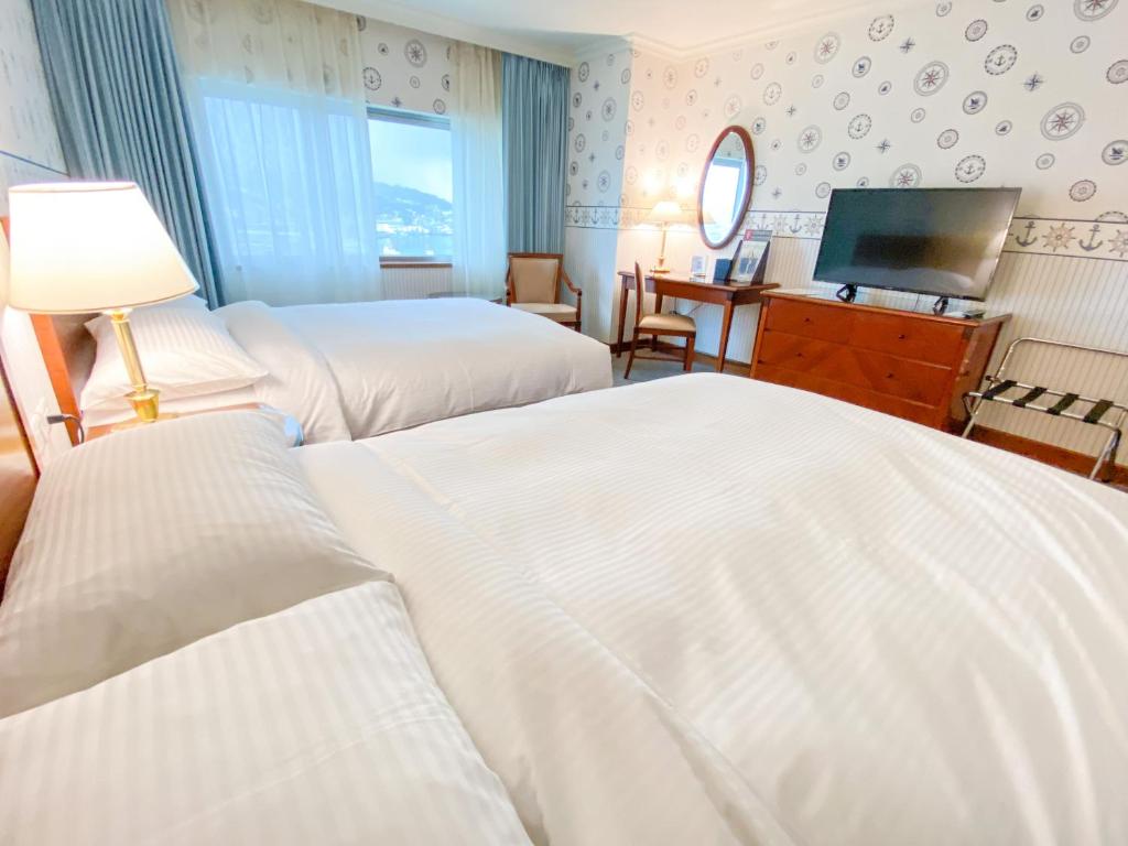 Voodi või voodid majutusasutuse Evergreen Laurel Hotel - Keelung toas