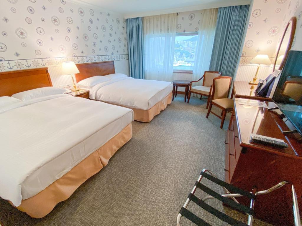Voodi või voodid majutusasutuse Evergreen Laurel Hotel - Keelung toas