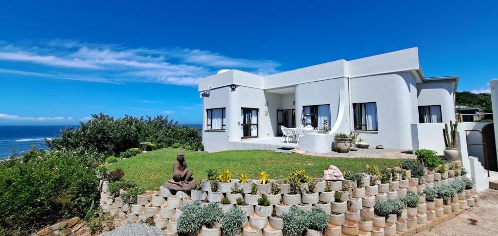 a villa with a view of the ocean at Angel's Rest in Port Alfred
