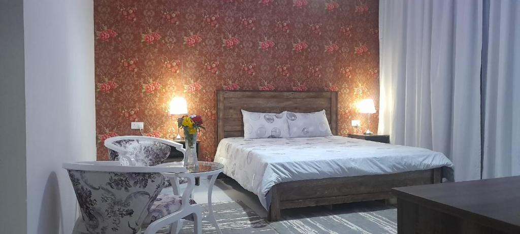 En eller flere senge i et værelse på بوابة الرمال السياحية Tourism sands gate