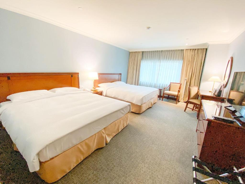 Voodi või voodid majutusasutuse Evergreen Laurel Hotel - Keelung toas