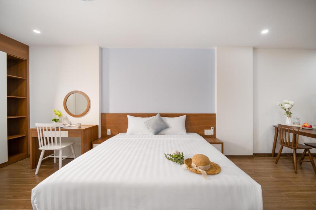 Giường trong phòng chung tại Samatha Apartment & Hotel