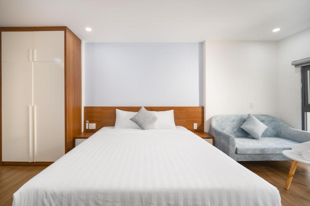 Giường trong phòng chung tại Samatha Apartment & Hotel