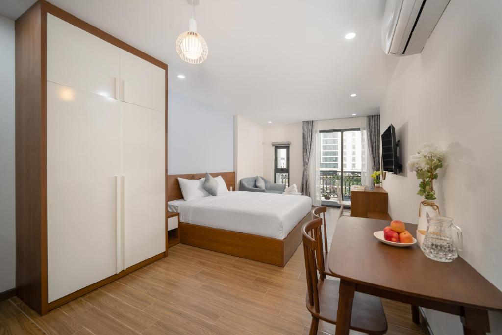 Giường trong phòng chung tại Samatha Apartment & Hotel