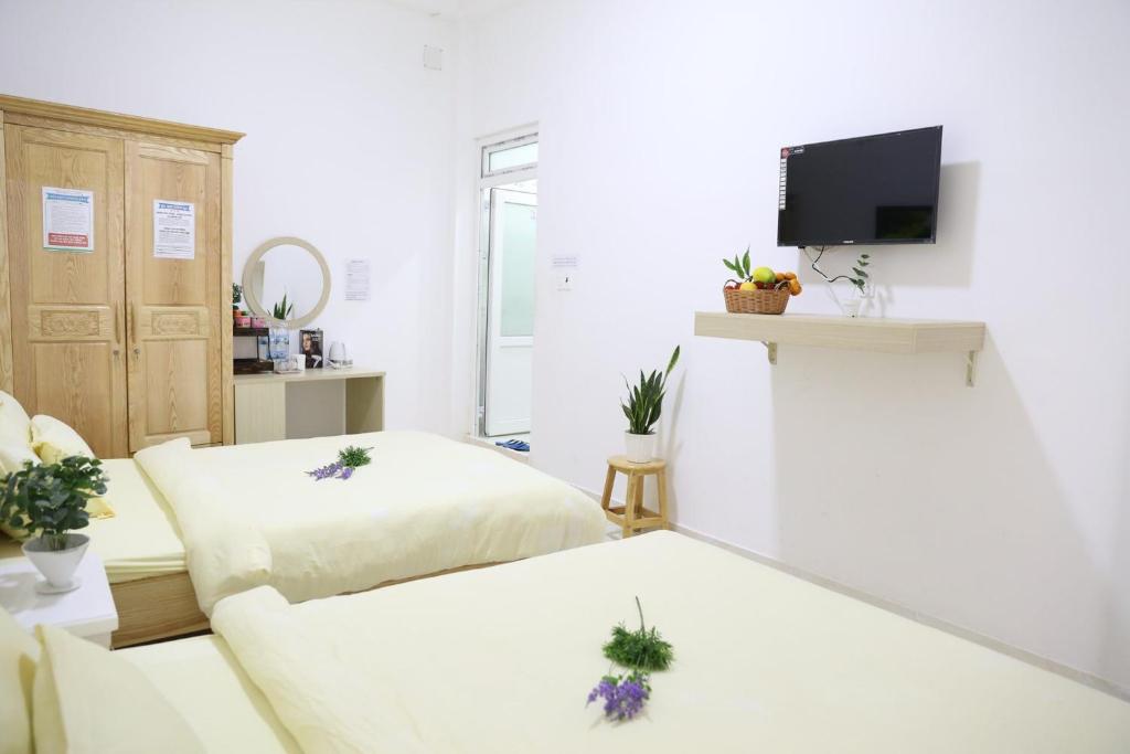 Postel nebo postele na pokoji v ubytování Strawberry Hotel Dalat