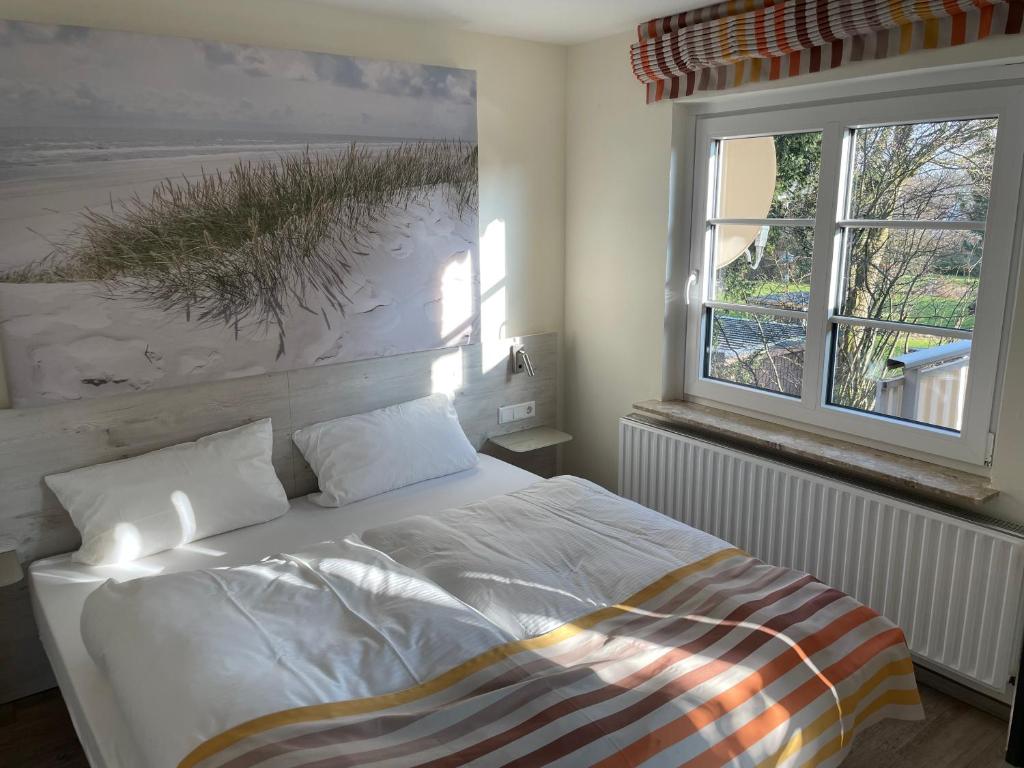 Postel nebo postele na pokoji v ubytování Hotel Osterkrug