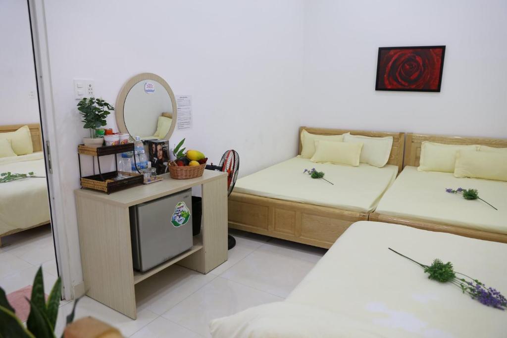 Postel nebo postele na pokoji v ubytování Strawberry Hotel Dalat
