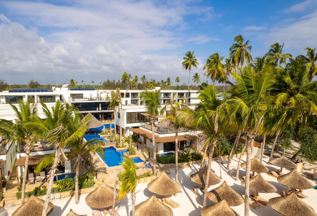 an aerial view of the resort with palm trees and umbrellas at TOA Hotel & Spa Zanzibar in Pongwe