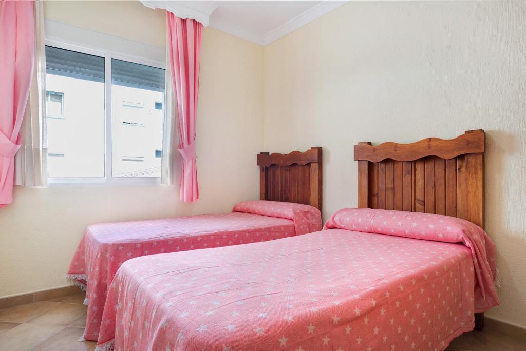 Posteľ alebo postele v izbe v ubytovaní Apartamento El Tajo