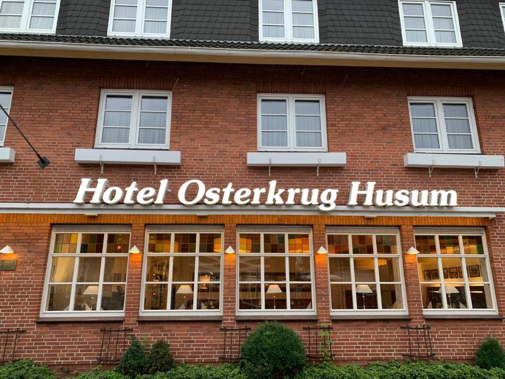 a hotel exterior of a brick building with a hotel officiating museum at Hotel Osterkrug in Husum