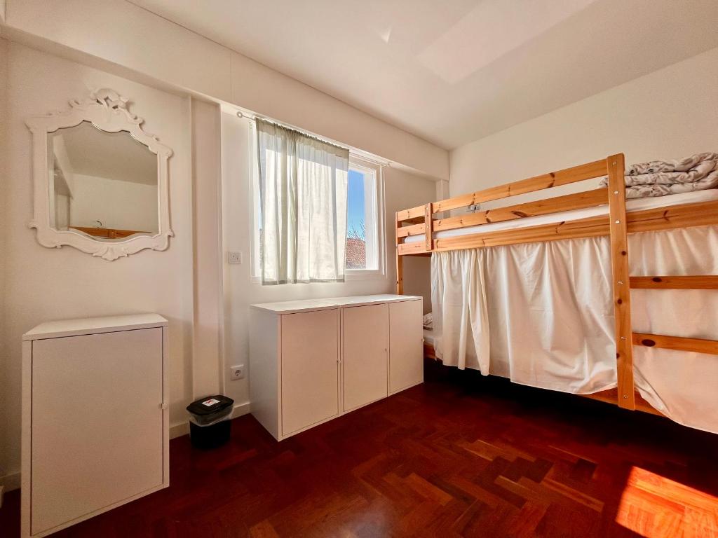 Postel nebo postele na pokoji v ubytování Hostel do Alto - Fão