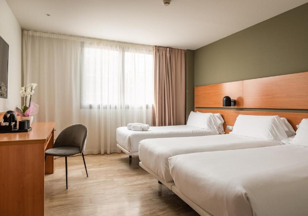 Postel nebo postele na pokoji v ubytování Hotel SB Express Tarragona